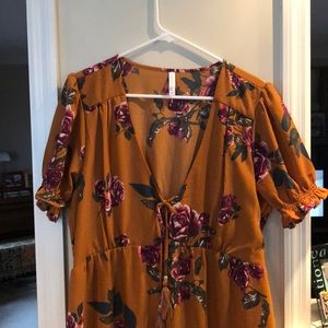 Orange floral dress.